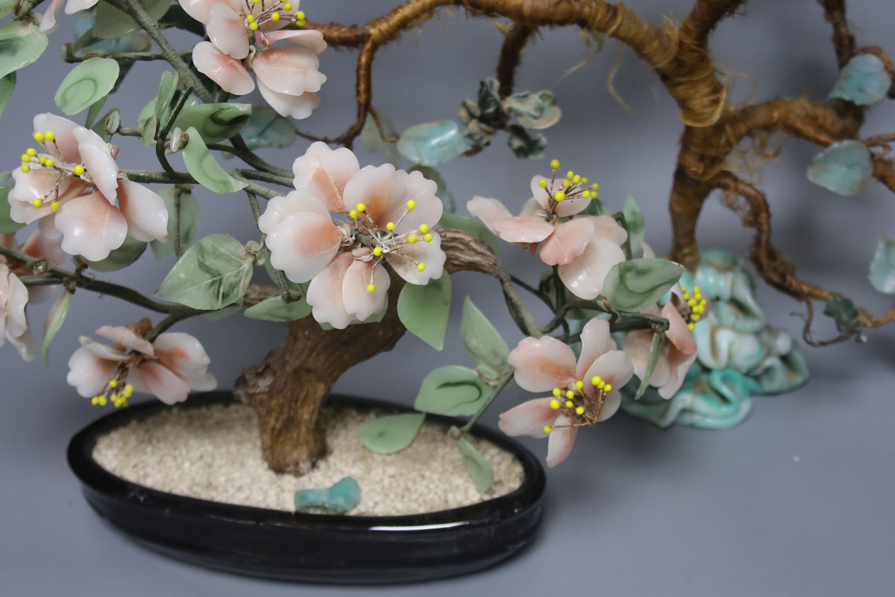 A pair of Chinese glass models of trees, tallest 29 cm
